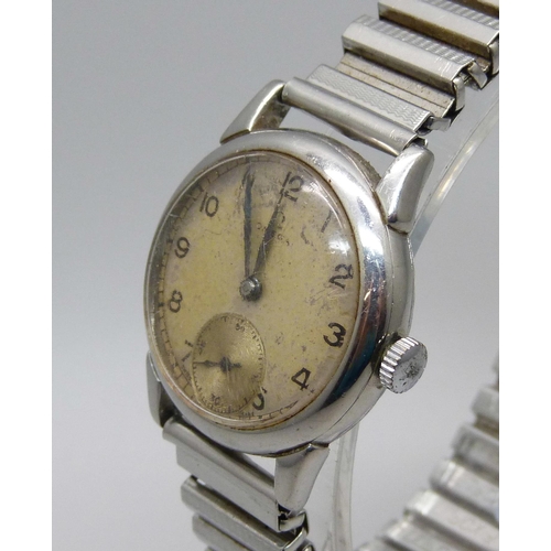 1125 - An Omega wristwatch with subsidiary second hand, new crown and inscribed back, probably 1950s