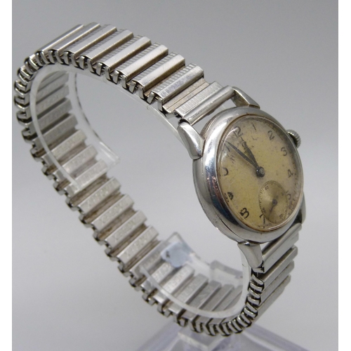 1125 - An Omega wristwatch with subsidiary second hand, new crown and inscribed back, probably 1950s