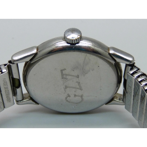 1125 - An Omega wristwatch with subsidiary second hand, new crown and inscribed back, probably 1950s