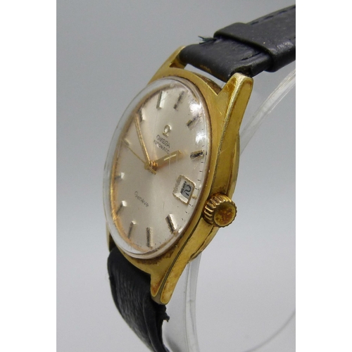 1128 - An Omega Geneve gold plated automatic wristwatch with date, sweep second hand