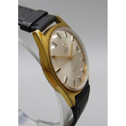 1128 - An Omega Geneve gold plated automatic wristwatch with date, sweep second hand