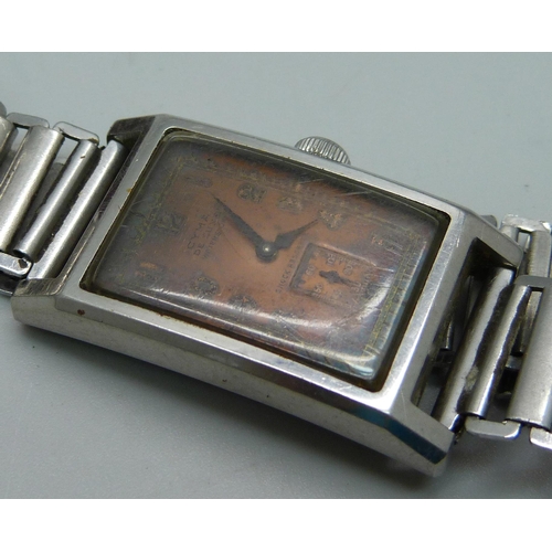 1131 - A Cyma De Luxe wristwatch, waterproof, shock resistant and a lady's Bulova Accutron wristwatch