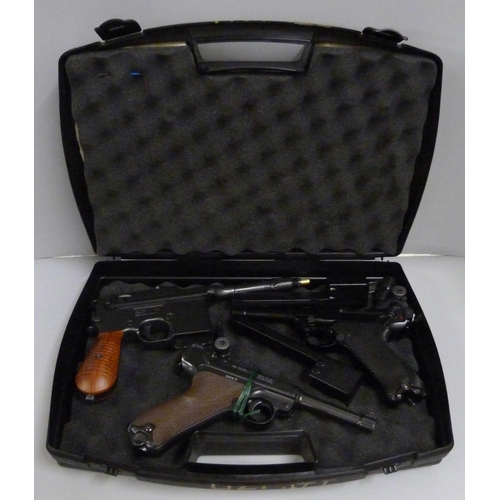 830 - Three air pistols including Gletcher and KWC, with case, a/f