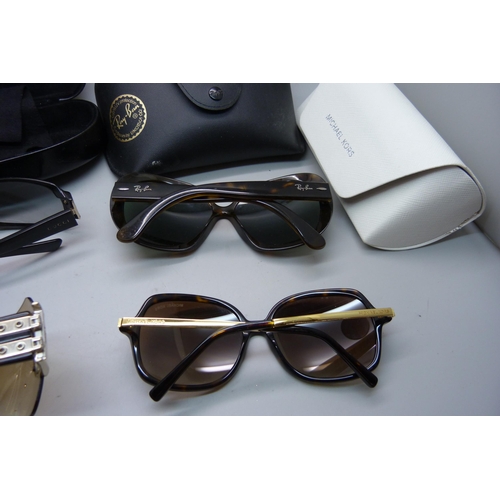 833 - Four pairs of sunglasses, Gucci, Dior, Rayban and Michael Kors