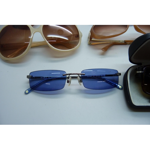 834 - A collection of lady's sunglasses including Persol and Barbour