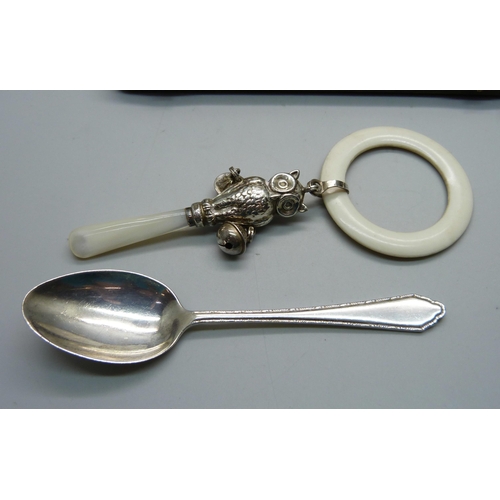 869 - A hallmarked silver Christening set, owl rattle and spoon, spoon 24g and 137mm