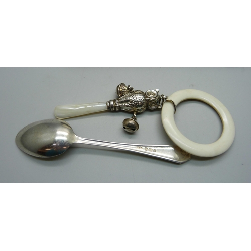 869 - A hallmarked silver Christening set, owl rattle and spoon, spoon 24g and 137mm