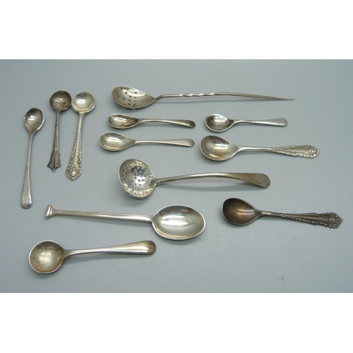 872 - A collection of silver condiment spoons, silver sifter, silver mote spoon, 68.7g