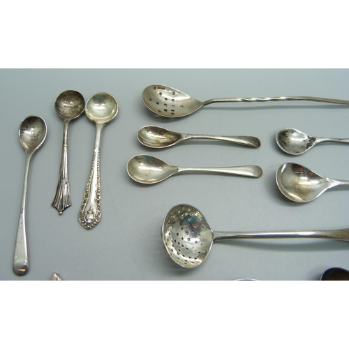 872 - A collection of silver condiment spoons, silver sifter, silver mote spoon, 68.7g