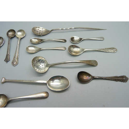 872 - A collection of silver condiment spoons, silver sifter, silver mote spoon, 68.7g