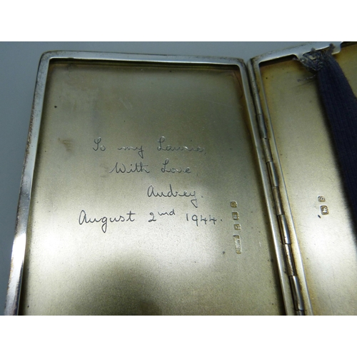 877 - A silver cigarette case, inner case bears inscription dated 1944, 176g, 8cm x 11cm