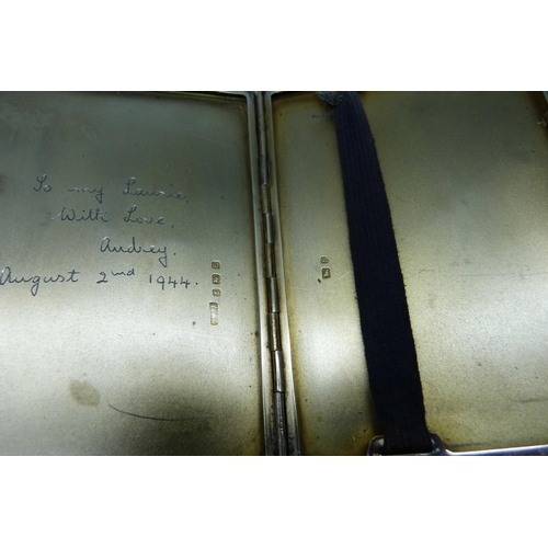 877 - A silver cigarette case, inner case bears inscription dated 1944, 176g, 8cm x 11cm