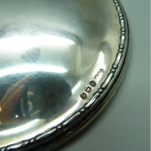 883 - A silver backed hand mirror