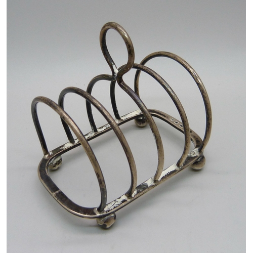 885 - A silver toast rack, London 1931, 43.3g