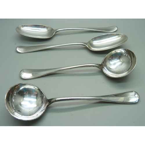 892 - A pair of silver rattail ladles, Sheffield 1907, 206g, and two plated serving spoons