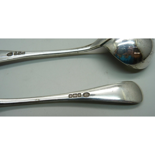 892 - A pair of silver rattail ladles, Sheffield 1907, 206g, and two plated serving spoons