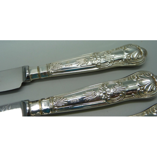 894 - A set of six Queens pattern table knives, Sheffield silver mark on handles