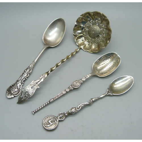 903 - A silver sifter ladle with stork finial and three other silver spoons, 57g