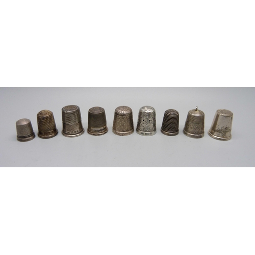 916 - Nine silver thimbles