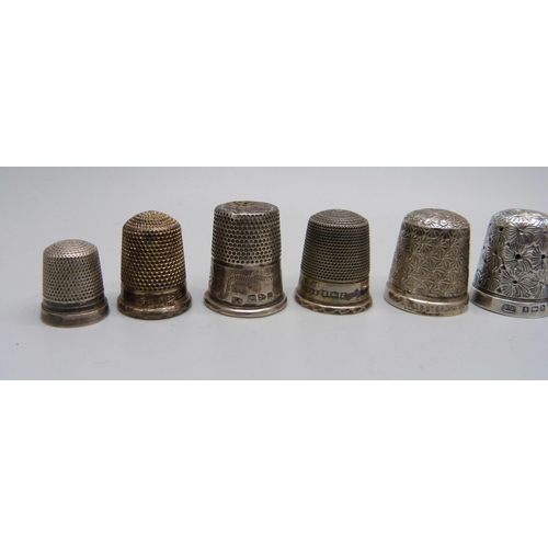 916 - Nine silver thimbles