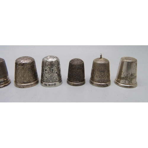 916 - Nine silver thimbles