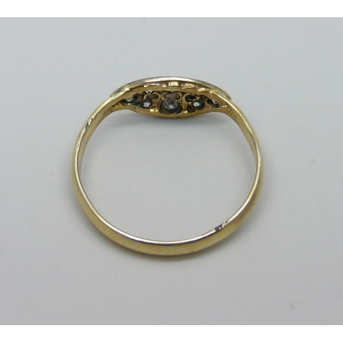 956 - A yellow metal diamond set ring, marked 18K, T