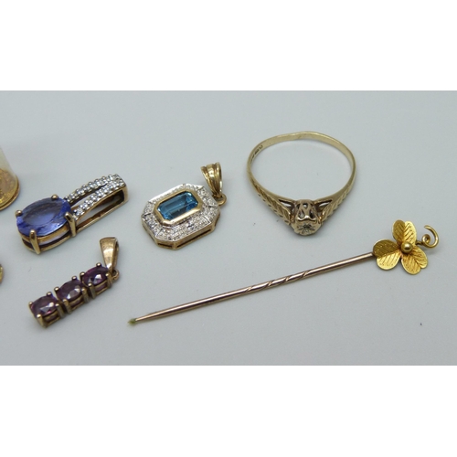 960 - A 9ct gold ring, four 9ct gold pendants, a 9ct gold charm and a yellow metal stick pin marked 15c, 1... 