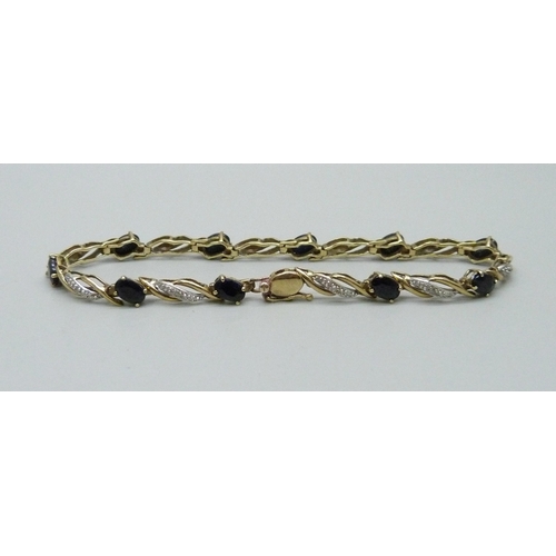 965 - A 9ct gold, diamond and sapphire bracelet, 7.3g, 19cm