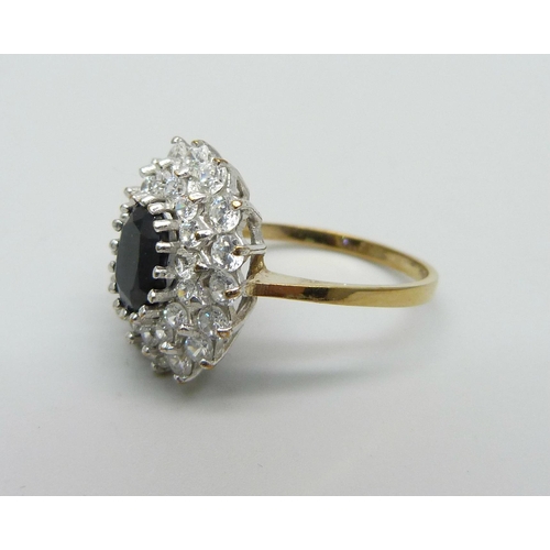 988 - A 9ct yellow gold sapphire and CZ cluster ring, O, 3.5g