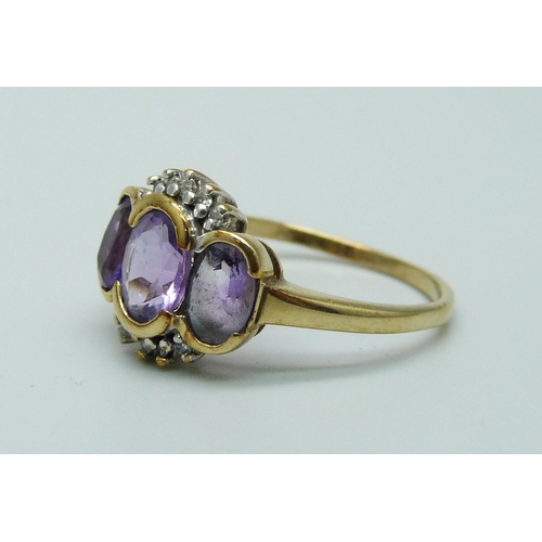 990 - A 9ct yellow gold amethyst and diamond ring, P, 2.5g