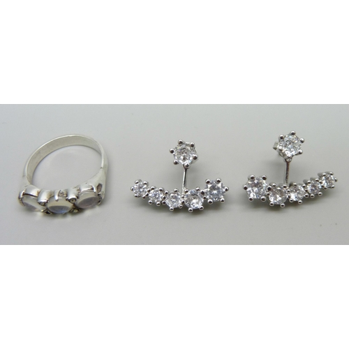 995 - A silver and moonstone ring and a pair of silver and clear stone earrings