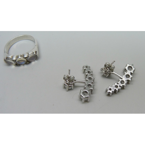 995 - A silver and moonstone ring and a pair of silver and clear stone earrings