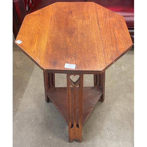 122 - An Arts & Crafts Liberty & Co. style oak octagonal occasional table