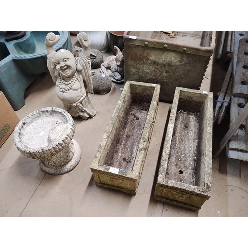 304 - Two concrete planters, a garden figure of a buddha and a bird bath