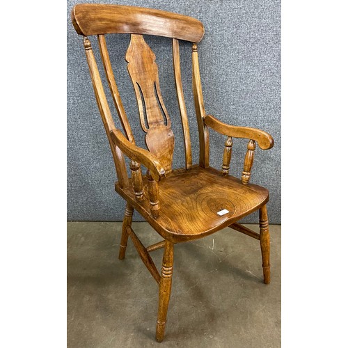 135 - A Victorian elm and beech farmhouse armchair