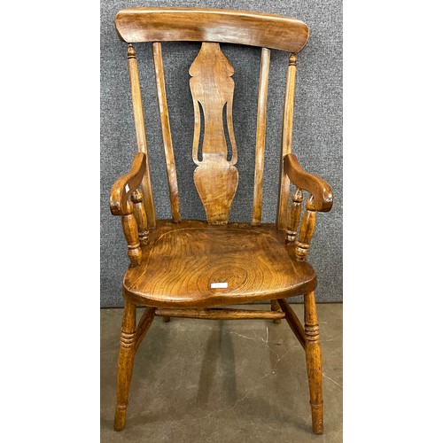 135 - A Victorian elm and beech farmhouse armchair