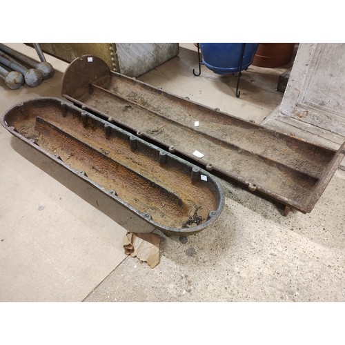 308 - Two cast iron feeding troughs