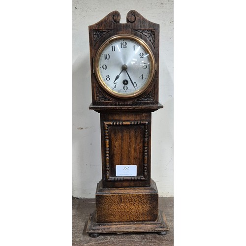 352 - An early 20th Century oak miniature longcase clock time piece