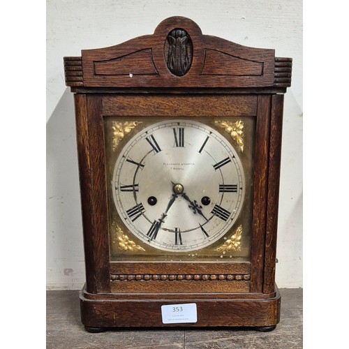 353 - An early 20th Century Pleasance & Harper, Bristol oak mantel clock