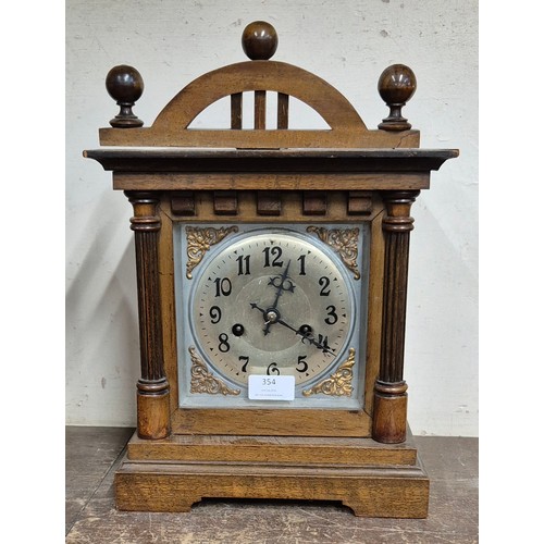 354 - An early 20th Century German walnut mantel clock