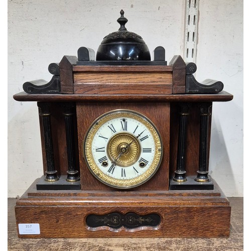 357 - An early 20th Century French oak and ebonised architectural cased mantel clock