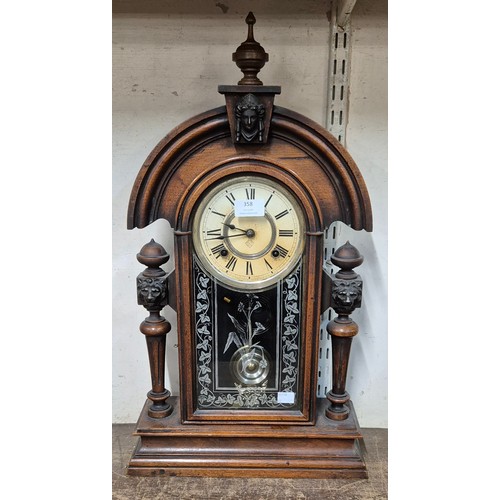 358 - An early 20th Century American Ansonia Clock Co. 8-day beech shelf clock