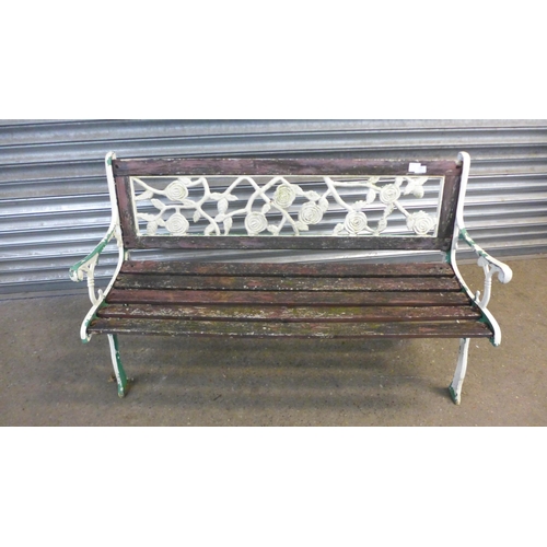 2201 - A 125cm  wooden garden bench with cast iron bench ends