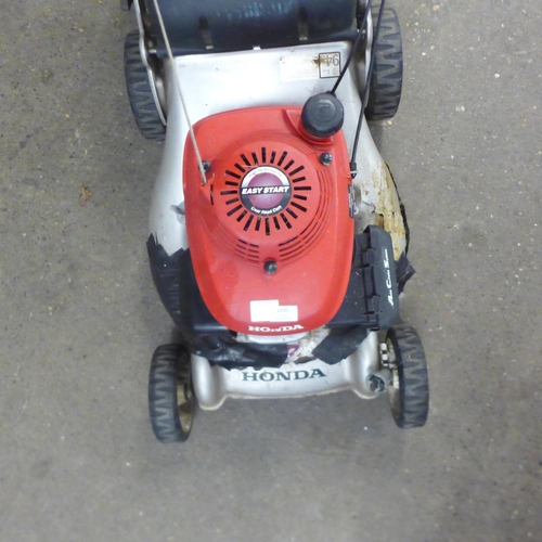 2205 - A Honda IZY petrol driven lawnmower with a Honda High Performance over head Cam easy start ACS petro... 