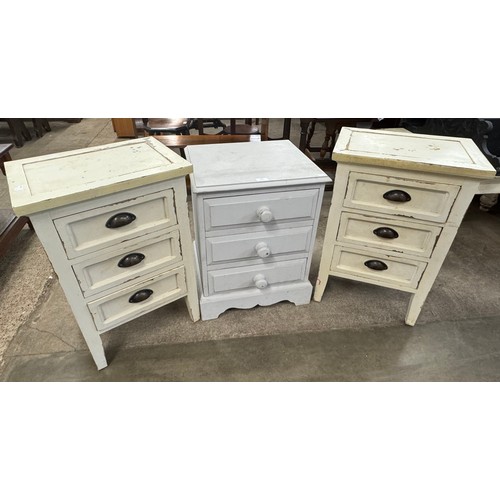 223 - A pair of white painted bedside cabinets and a small painted chest of drawers