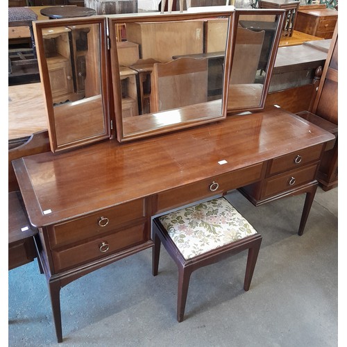 192 - A Stag Minstrel mahogany headboard and dressing table