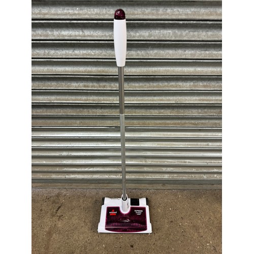 2425 - A Minky classic T-Leg 110 x 35cm ironing board, a Bissell supreme sweep turbo and one other sweeper