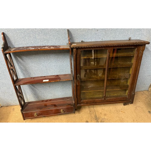 378 - An Edward VII carved oak wall hanging display cabinet and wall shelves