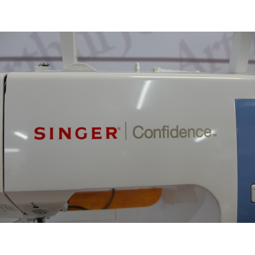 2349 - A modern Singer sewing machine, model number 7465 with accessories and materials