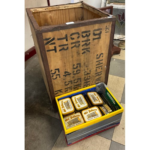 381 - A tea crate containing a collection of tobacco tins